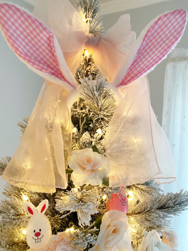 Glowing Easter Tree with Pink gingham easter bunny ears and sheer pink scarf as tree topper