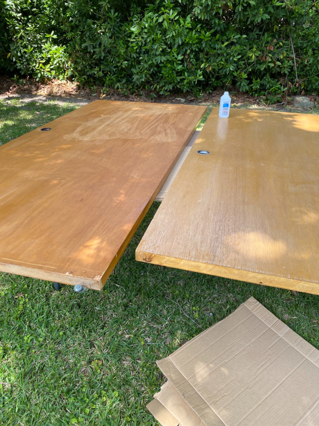oak colored closet doors outside on table getting ready to pain