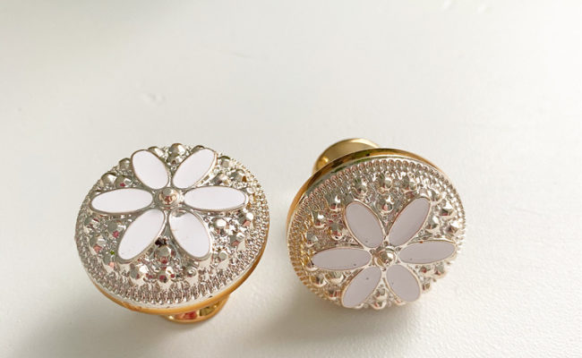 White with gold daisy flower drawer pulls