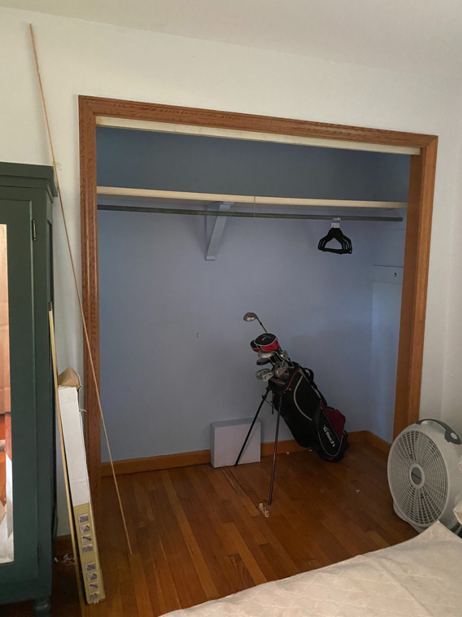 before of closet with doors off before painted 