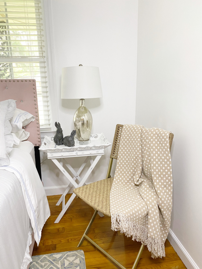 chair and side table in guest room 