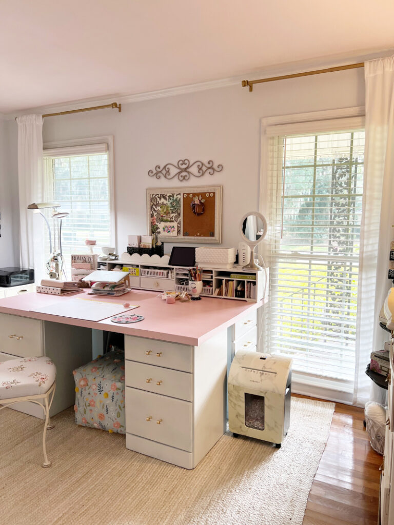 pink desk with white cabinets 