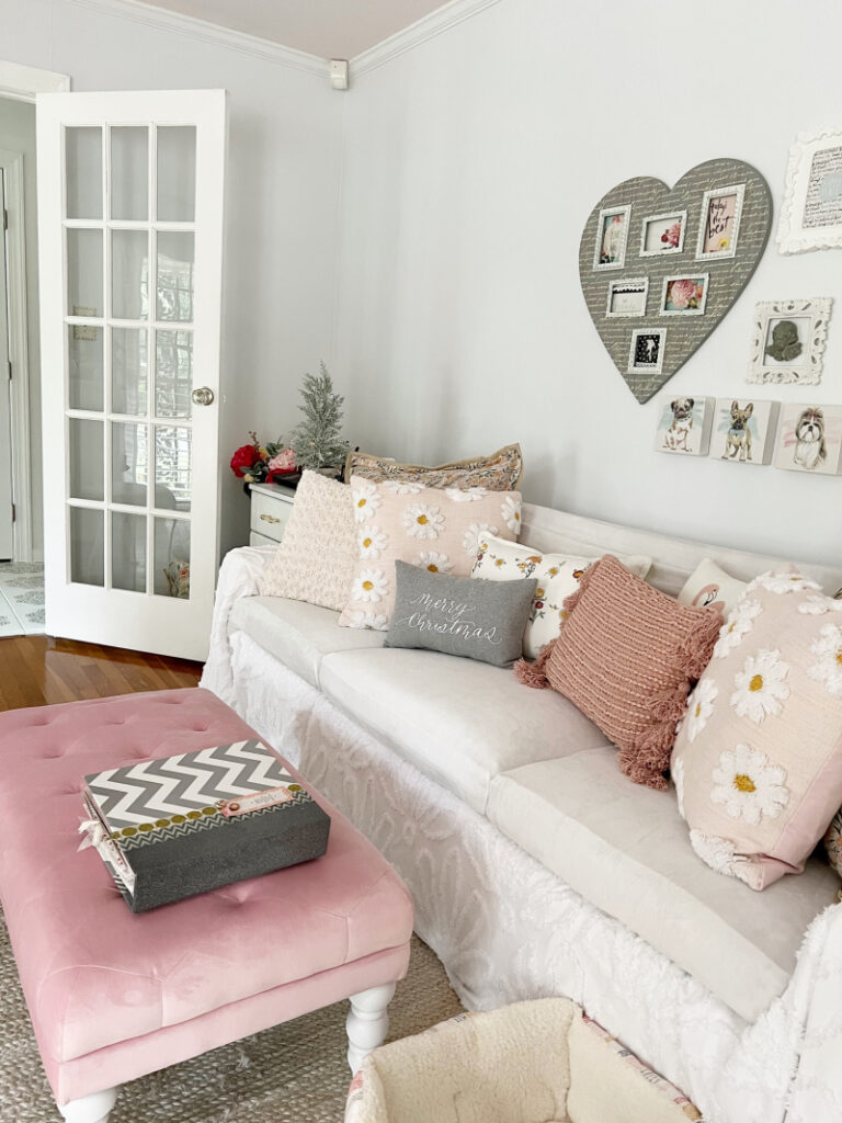 White velvet slip covered sofa with pillows