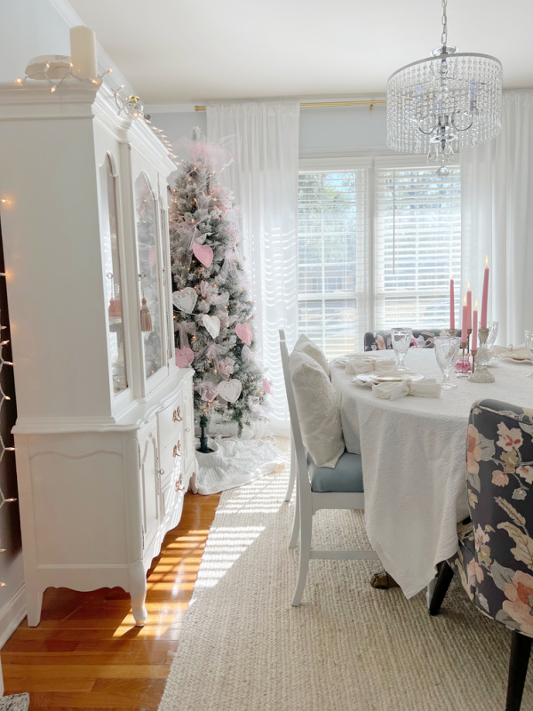 decorated pink and white valentine's tree in dining room